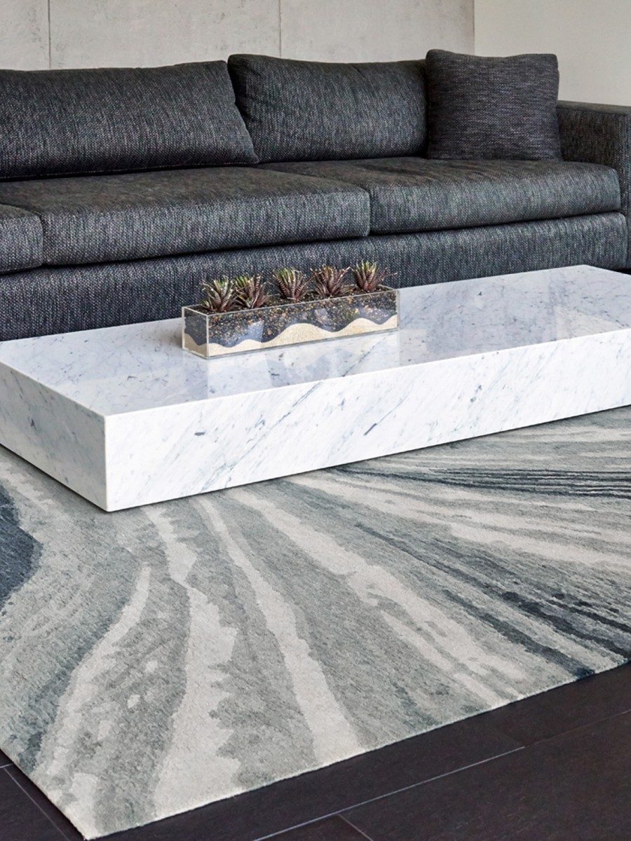 Potosi rug in living room with marble coffee table and gray couch