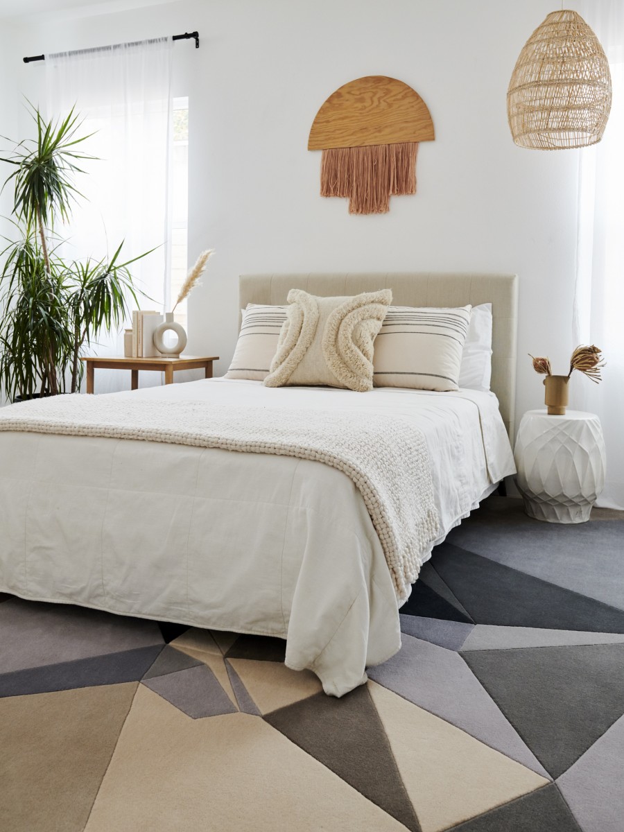 Neutral toned bedroom with Geometric rug by Karim Rashid 